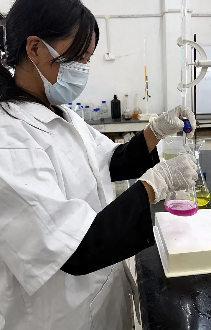 Titration against a colour change indicator to determine chemistry